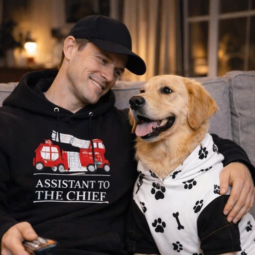 Man wearing "Assistant to the Chief" hoodie with dog sitting on the couch