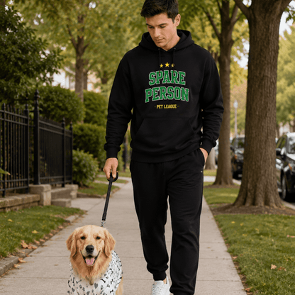Man walking a dog on a leash in a park-like setting