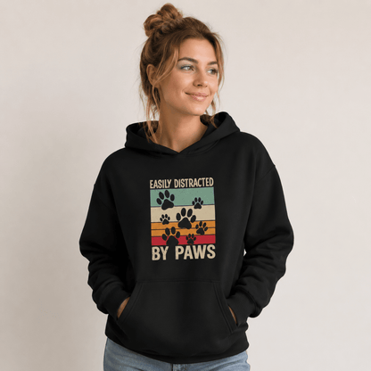 Human hoodie: "Oversized fleece hoodie reading 'Easily Distracted by Paws' worn by dog owner"