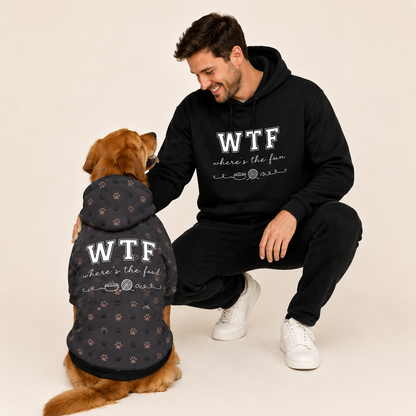 Man and dog wearing matching black hoodies with 'WTF where's the fun' text on a beige background