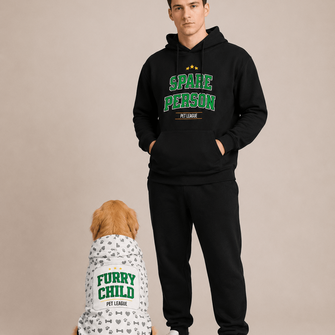 Man wearing a black hoodie with 'Space Person' text and a dog wearing a white shirt with 'Furry Child' text, both from Pet League, on a beige background.
