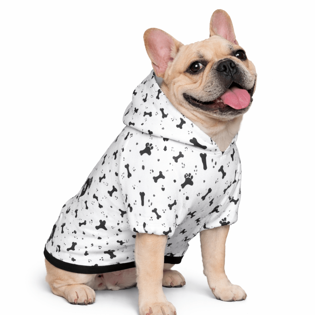 Dog wearing a black and white patterned thug life hoodie on whitecbackground